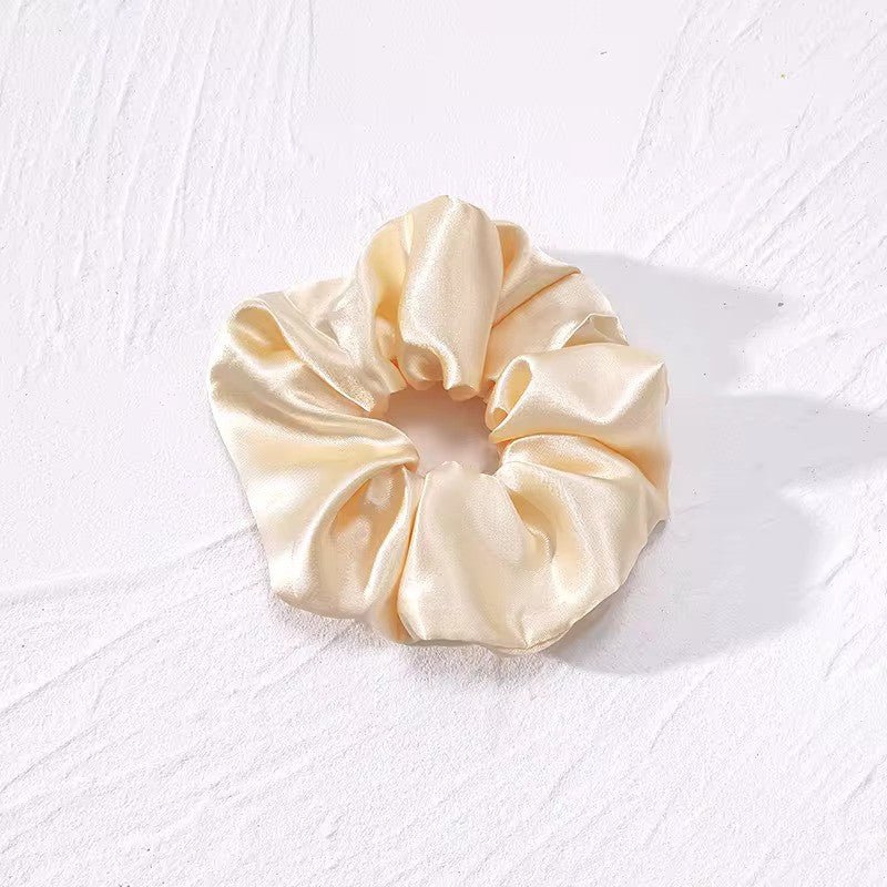 Satino plaukų gumelė gelsvos spalvos - Plaukuota-gumelės