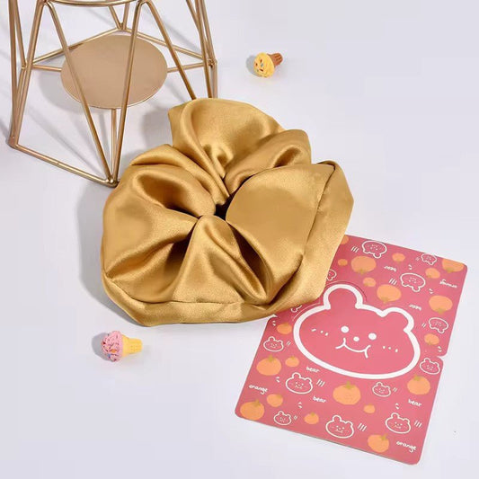 Satino plaukų gumelė auksinės spalvos, didelė - Plaukuota-gumelės