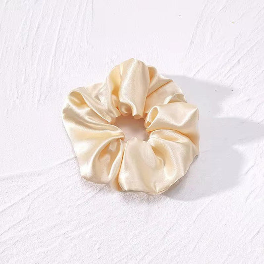 Satino plaukų gumelė gelsvos spalvos - Plaukuota-gumelės