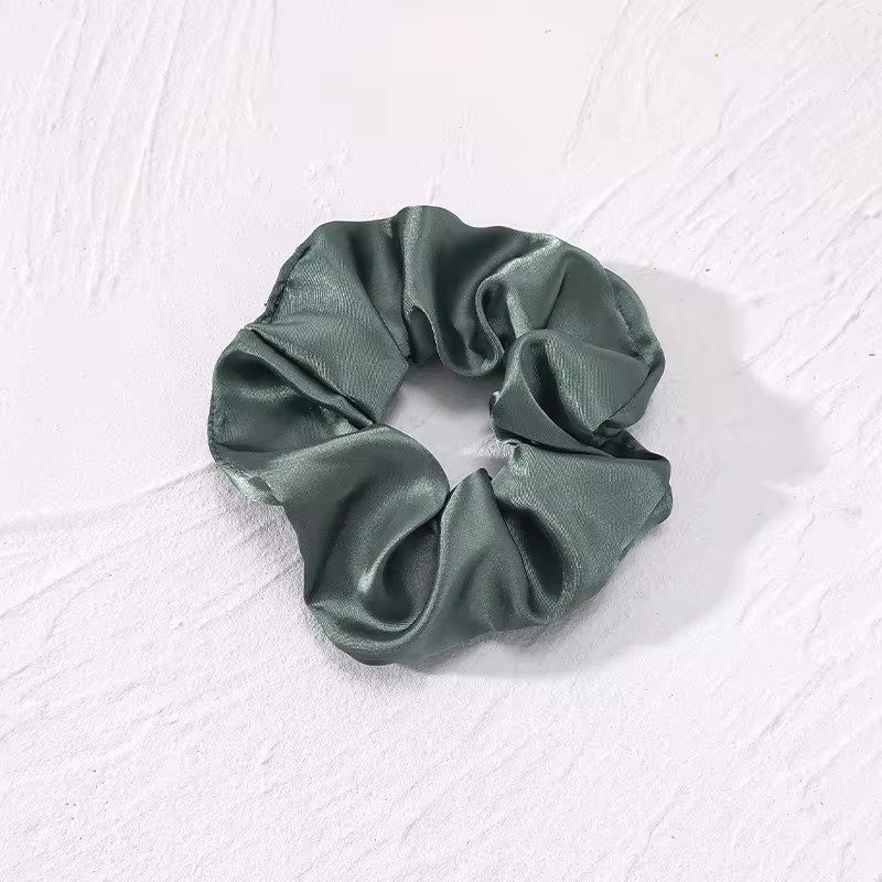 Satino plaukų gumelė tamsiai žalios spalvos - Plaukuota-gumelės